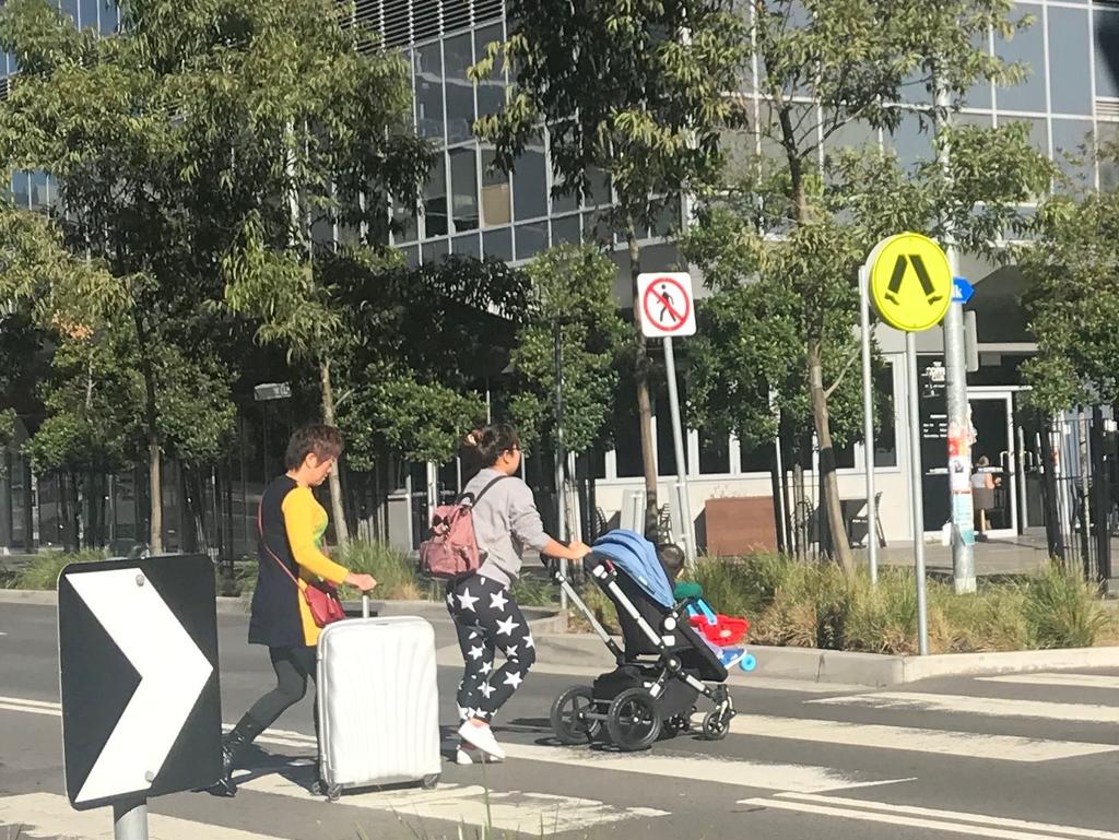 More residents carrying their belongings across the street. Picture: Supplied.