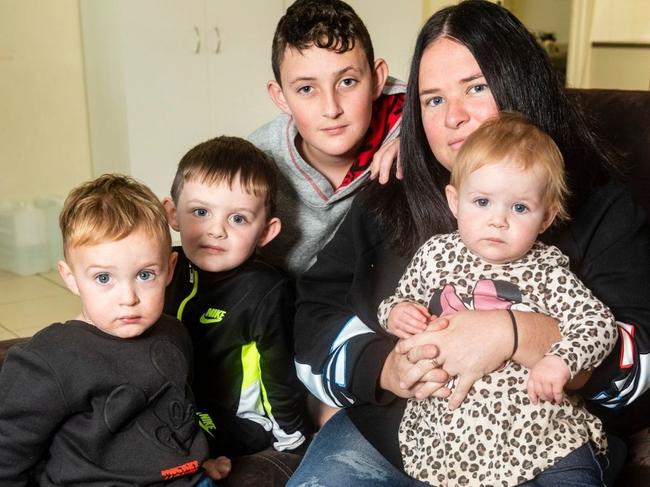 Pregnant mother Hayley Ebborn in the Wilsonton rental property she has no alternative but to stay in even though she is worried about the health of her young family (from left) Braxton, Skylah, Anthony and (front) Jarrell Forsyth due to mould and dampness issues. Sunday, May 8 2022.