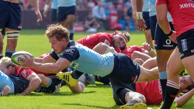 Waratahs star Michael Hooper scores against the Lions.