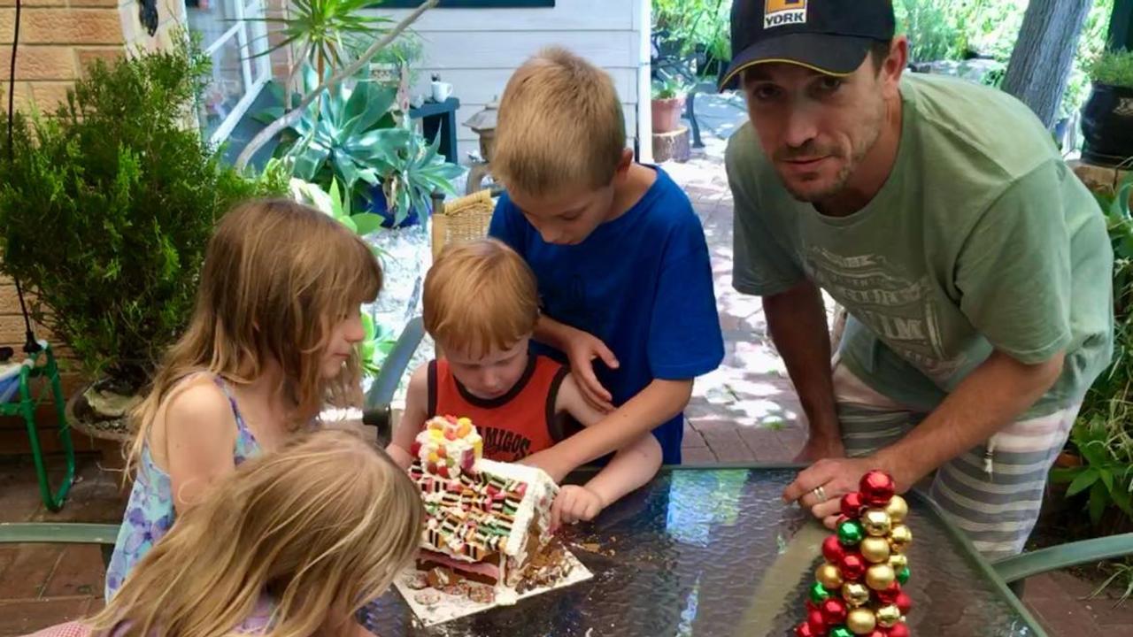 At Christmas time, Patrick Hillmann loved to help the kids build and destroy gingerbread houses. Picture: Shannon Hillmann.