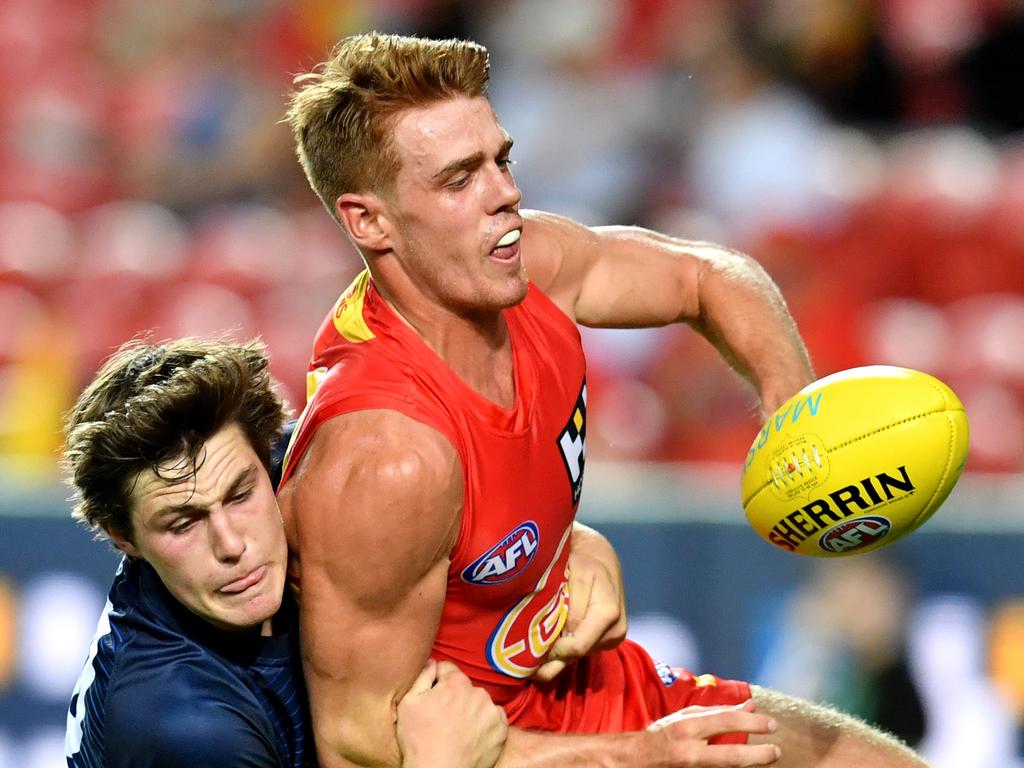 Jez McLennan (right) has yet to play a senior AFL game entering his fourth season at the Suns. Picture: AAP Image/Darren England