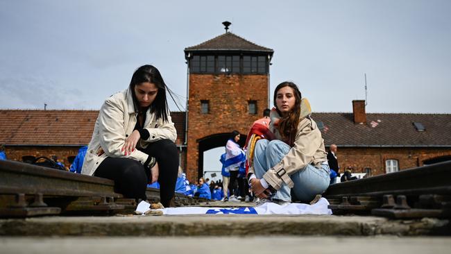 Just days later participants mourn on the train tracks during the 35th March of the Living on April 18. It is an educational program aimed at Jewish youth from around the world to better understand the history of the Holocaust. Picture: Omar Marques/Getty Images