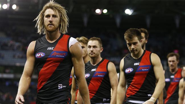 Essendon captain Dyson Heppell leads his dejected teammates off the ground. Picture: AAP