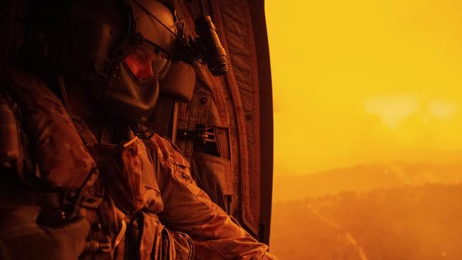 Warrant Officer Darrel Rowe, from the 5th Aviation Regiment, above a scorched Victoria during the Black Summer fires.