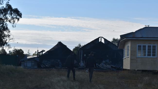 Fire and police investigators at the scene on Friday morning working to determine the cause of the blaze. Picture: Chloe Cufflin.