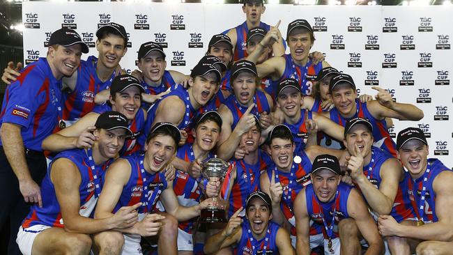 The victorious Chargers celebrate with the premiership cup.