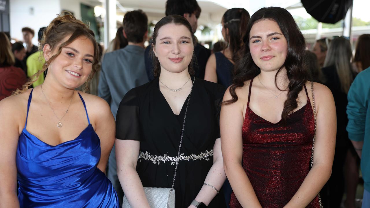 Lavinia Green, Kayla Goodman and Catalan White at Coombabah State 2024 High School Formal at the Gold Coast Turf Club. Picture: Portia Large.