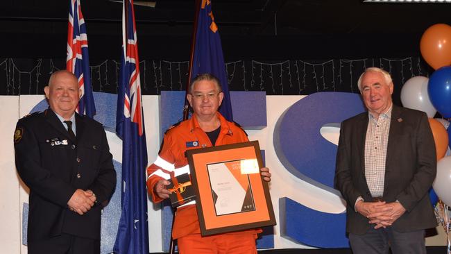 Brian Cook (centre) received a citation for "distinguished service to the SES through exceptional leadership, dedication and training of fellow members." at SES Week Awards on Saturday. He is flanked (from left) by SES Regional Manager Robert Bundy and Toowoomba Mayor Paul Antonio.