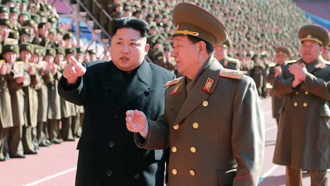 Kim Jong-un with Hwang Pyong-So at a meeting of military and political cadres. Picture: AFP.