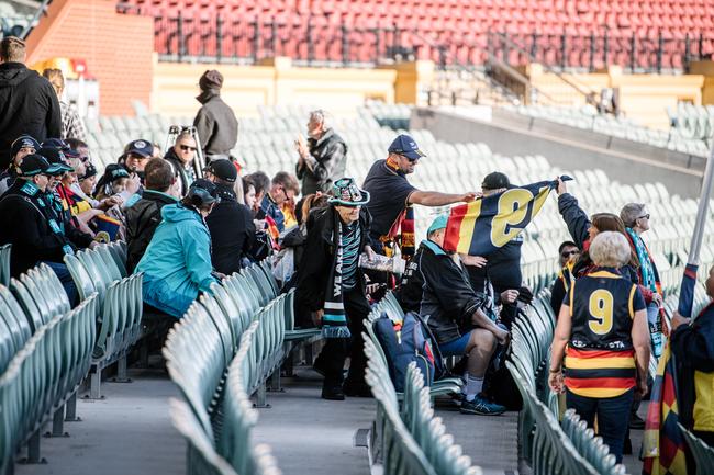 Crows and Port Adelaide fans sitting together on the southern side of Adelaide Oval as extras in the film 
