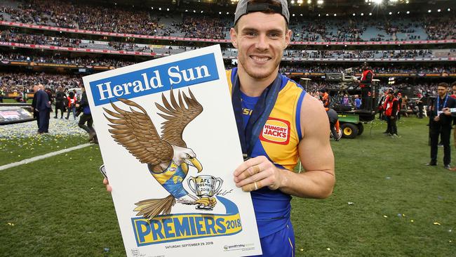 Norm Smith Medallist Luke Shuey with the Herald Sun premiership poster. Picture: Michael Klein