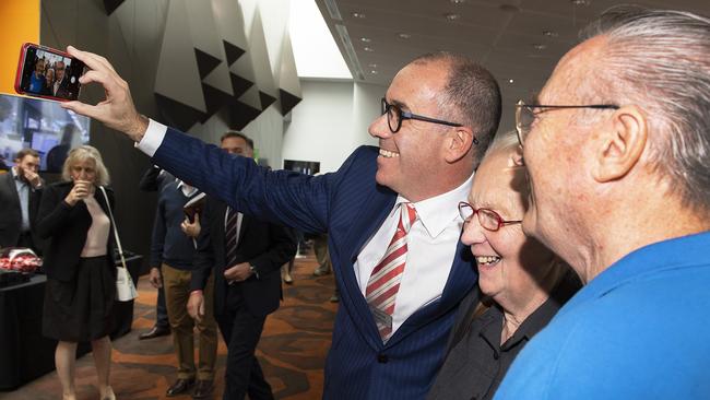 NAB CEO Andrew Thorburn takes a selfie with shareholders before the AGM. Pic: AAP