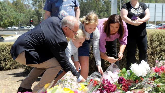 Prime Minister Scott Morrison and his family pay their respects at Bundoora. Picture: Andrew Henshaw