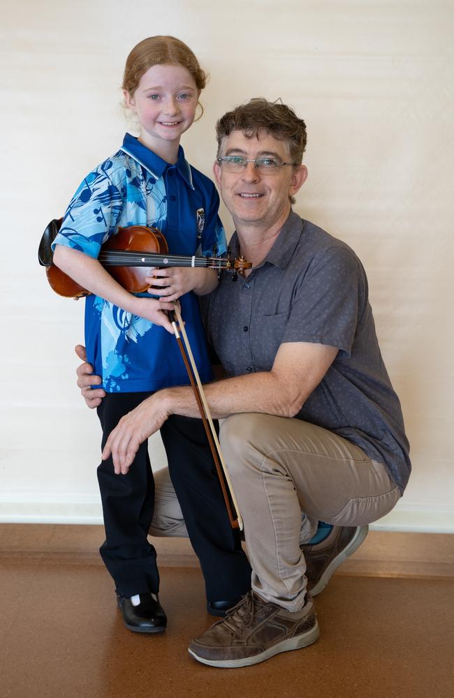 Mya Bray won first place for her string solo (8 years and under) at the Gympie Eisteddfod. Pictured with her dad, Jason Bray. August 1, 2023. Picture: Christine Schindler