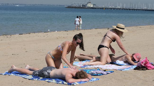 Beachgoers have flocked to St Kilda today. Picture: AAP