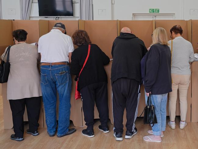MELBOURNE, AUSTRALIA - APRIL 22: People cast their votes at a ballot box at an early voting centre in the suburb of Oakleigh in the federal seat of Hotham ahead of the Australian Federal Election on April 22, 2025 in Melbourne, Australia. Ã¢â¬â¹Early voting opened Monday, allowing Australians to cast their ballots before the May 3 federal election. The practice has become increasingly popular, with up to half of voters expected to vote early this year, reflecting a long-term shift toward pre-poll participation. (Photo by Asanka Ratnayake/Getty Images)