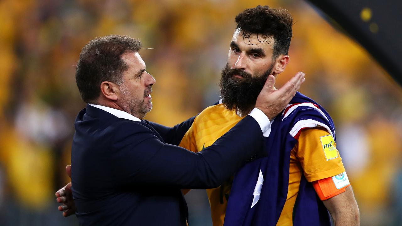 SYDNEY, AUSTRALIA - NOVEMBER 15: Australia Coach Ange Postecoglou and Mile Jedinak of Australia celebrate victory during the 2018 FIFA World Cup Qualifiers Leg 2 match between the Australian Socceroos and Honduras at ANZ Stadium on November 15, 2017 in Sydney, Australia. (Photo by Mark Kolbe/Getty Images)