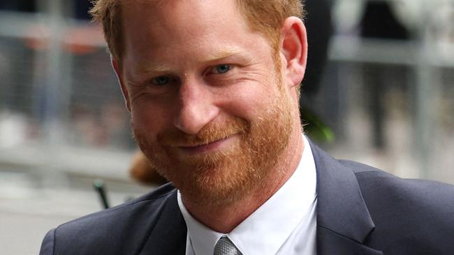 TOPSHOT - Britain's Prince Harry, Duke of Sussex, waves as he arrives to the Royal Courts of Justice, Britain's High Court, in central London on June 7, 2023. Prince Harry testified he had suffered lifelong "press invasion" and that some media had blood on their hands, as he became the first British royal in more than 100 years to give evidence in court. (Photo by Adrian DENNIS / AFP)