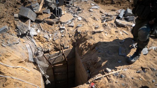 Israeli soldiers at the entrance of a Hamas tunnel in April. Picture: IDF via AFP