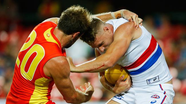 Jake Stringer tries to break away from a Kade Kolodjashnij tackle. Picture: Getty Images