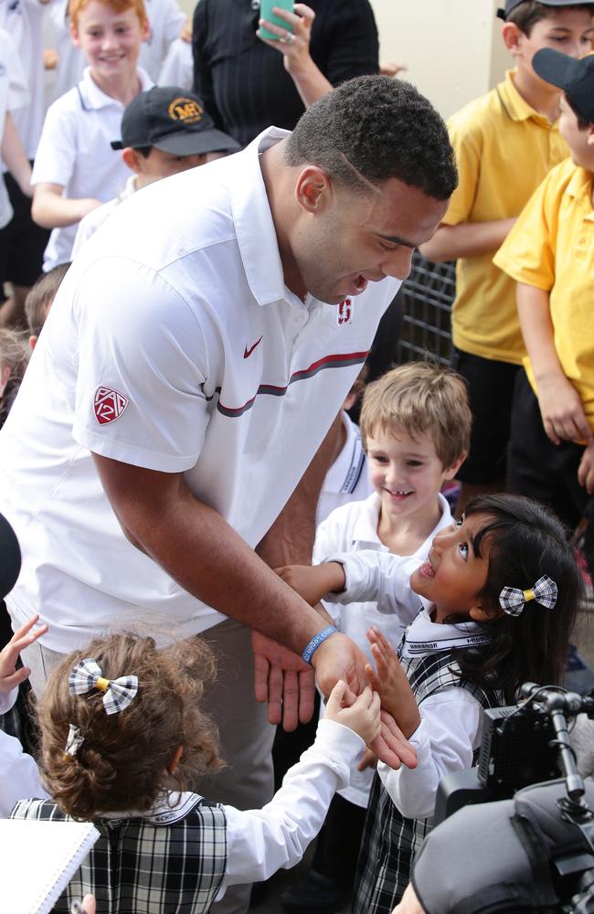 The little ones were thrilled to get a high five. Picture: Virginia Young