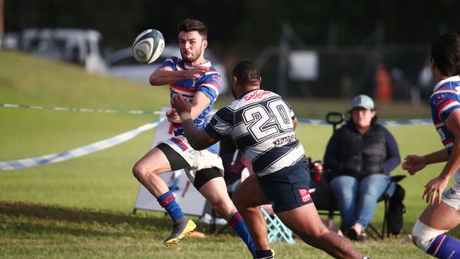 Bull's Duane Eramus flick the ball back into the field of play in the FNQ Rugby match between the Barron Trinity Bulls and Cairns Brothers, held at Stan Williams Park, Manunda. PICTURE: BRENDAN RADKE