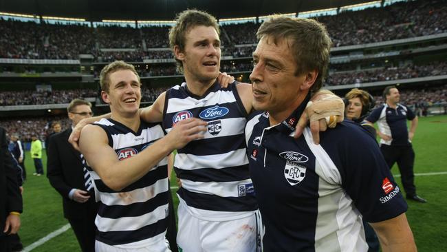 Joel Selwood, Cameron Mooney and Mark Thompson celebrate winning the 2007 grand final.