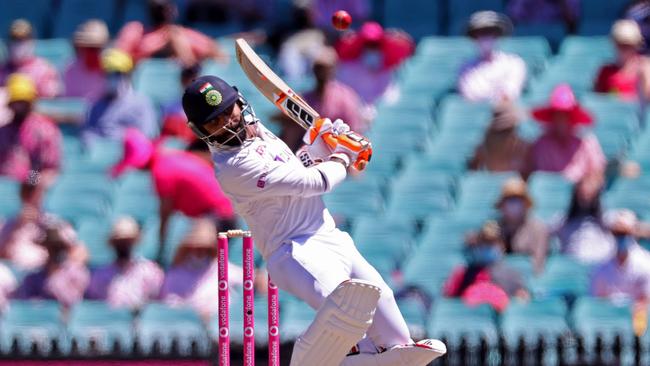 Ravindra Jadeja takes evasive action to avoid part of Australia’s shot ball barrage.