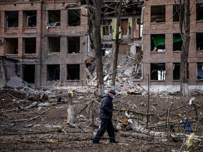 A man walks in front of a destroyed building after a Russian missile attack in the town of Vasylkiv, near Kyiv. Picture: AFP