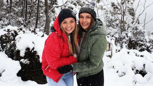 Friends from Hobart Brooke Rogers and Milly Russell near Lake Dobson at Mount Field. Lots of snow with more on the way. Picture: NIKKI DAVIS-JONES