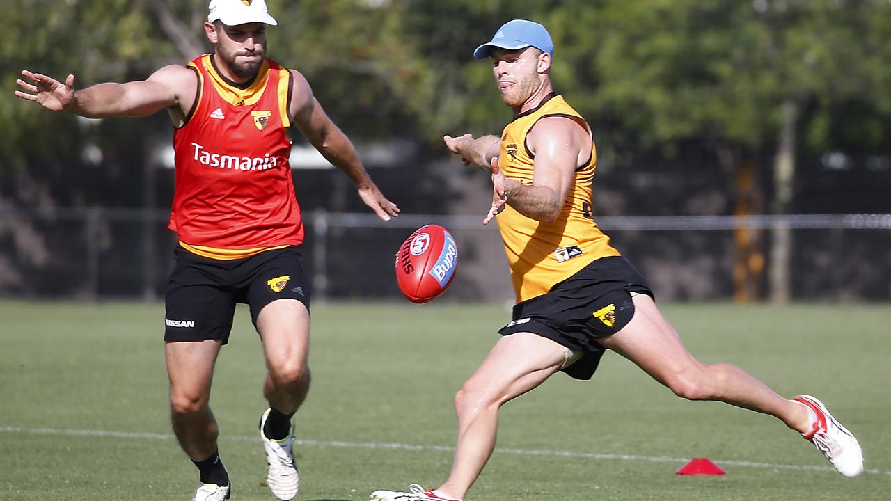 Tom Mitchell kicking on the run at Hawthorn training. Picture: Ian Currie