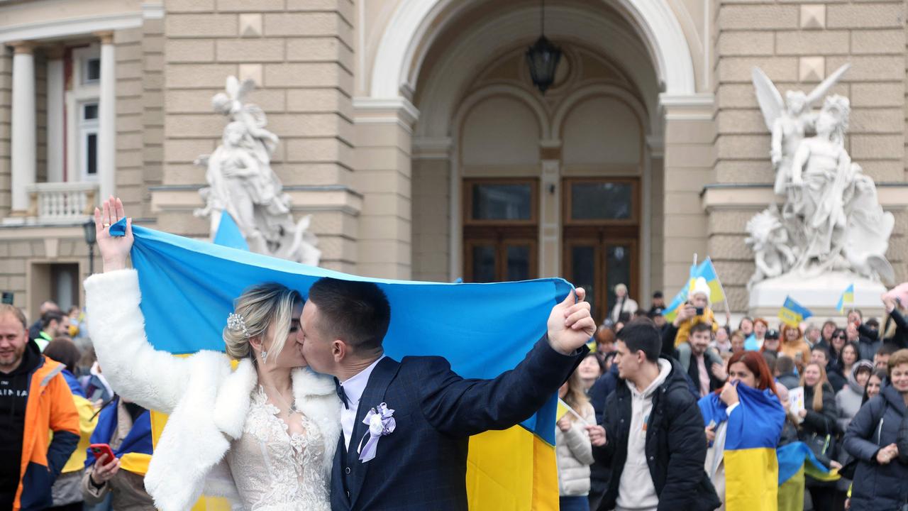 Newlyweds celebrate the liberation of Kherson. Picture: Oleksandr Gimanov/AFP