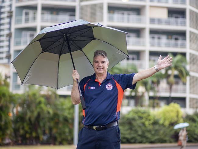 NT Emergency Service Northern Command planning officer Brian Hennessy was prepared with an umbrella for the wet weather on Tuesday morning. Picture: Floss Adams.