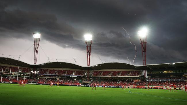 Lightning strikes during Round 1 AFL match GWS Giants v Sydney Swans at Spotless Stadium, Sydney Olympic Park. There was a delay at quarter time. pic. Phil Hillyard