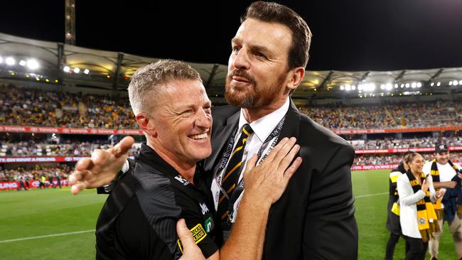 Damien Hardwick, Senior Coach of the Tigers and CEO Brendon Gale celebrate after the 2020 Toyota AFL Grand Final match between the Richmond Tigers and the Geelong Cats at The Gabba