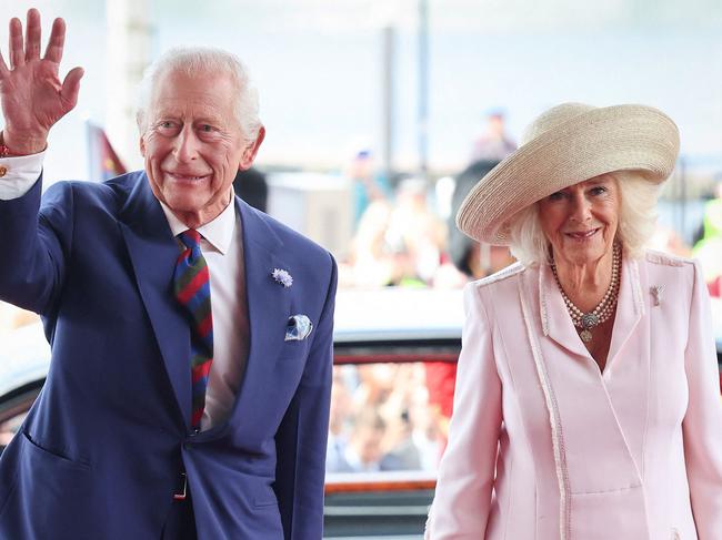 Britain's King Charles III and Britain's Queen Camilla arrive to meet members of the Welsh Parliament during a visit to commemorate the 25th anniversary of the Senedd, in Cardiff on July 11, 2024. (Photo by Chris Jackson / POOL / AFP)