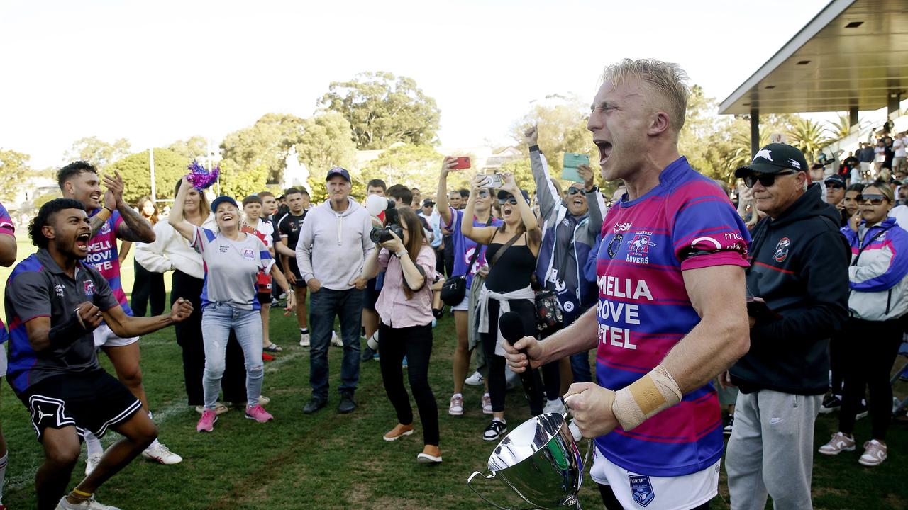 Alexandria Rovers' Andy Tull accepts the trophy to celebrate their victory. Picture: John Appleyard