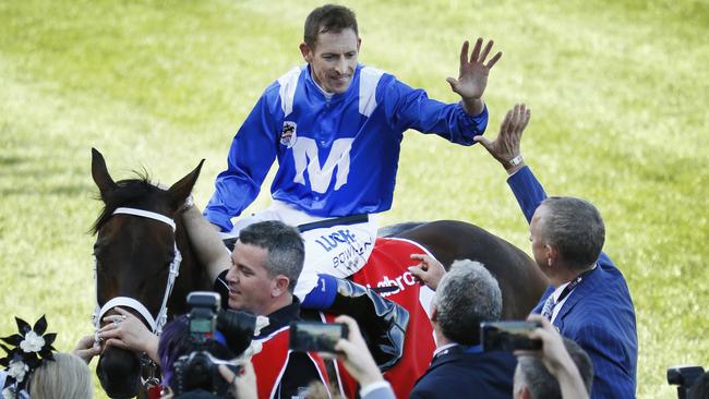 Cox Plate Moonee Valley. Winner of the Cox Plate Winx ridden by jockey Hugh Bowman. The Winx connections celebrate the win on the track. Picture: David Caird