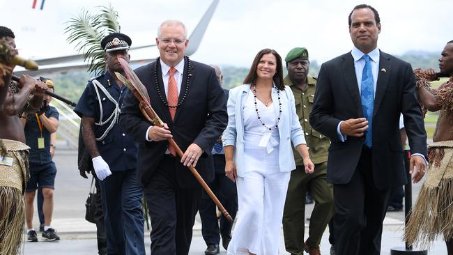 Australian Prime Minister Scott Morrison and Mrs Morrison are greeted by Vanuatu Minister of Foreign Affairs Ralph Regenvanu, right, as they arrive in Port Vila, Vanuatu, last month. Picture: AAP 