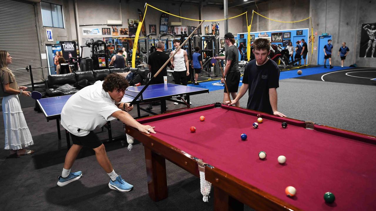 A couple of youths get stuck into pool. Picture: Patrick Woods.