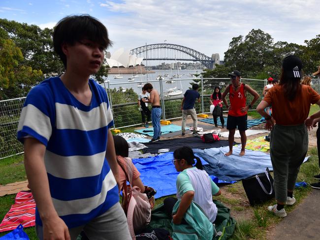 People are seen setting up at Mrs Macquarie's Point in preparation for New Years Eve Fireworks in Sydney, Monday, December 31, 2018. Picture: AAP / Brendan Esposito