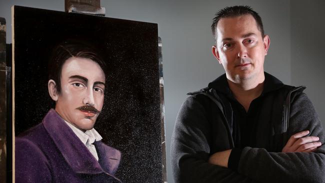 Campbelltown Artist Michael Fardon with his portrait of a 34-year-old Fred Fisher. Picture: Robert Pozo