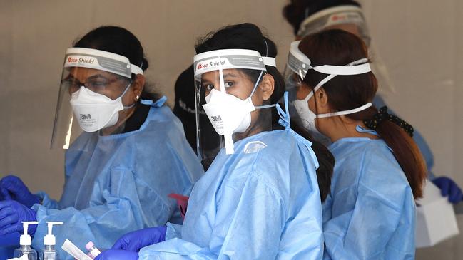 Health workers at a Brisbane Covid-19 testing site. Picture: NCA NewsWire/Dan Peled