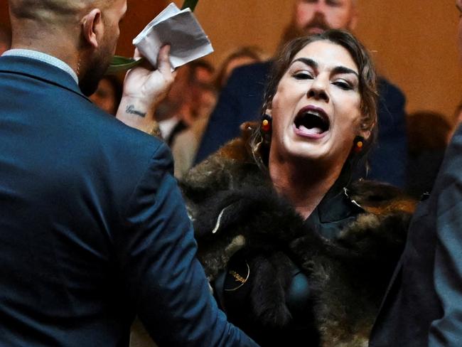 Australian Senator Lidia Thorpe stages a protest as Britain's King Charles and Queen Camilla attend a Parliamentary reception in Canberra, Australia - 21 Oct 2024. Victoria Jones/Pool via REUTERS     TPX IMAGES OF THE DAY