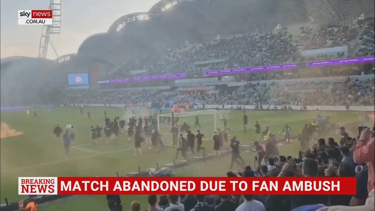 A-League Melbourne derby abandoned due to chaotic scenes with a violent pitch invasion