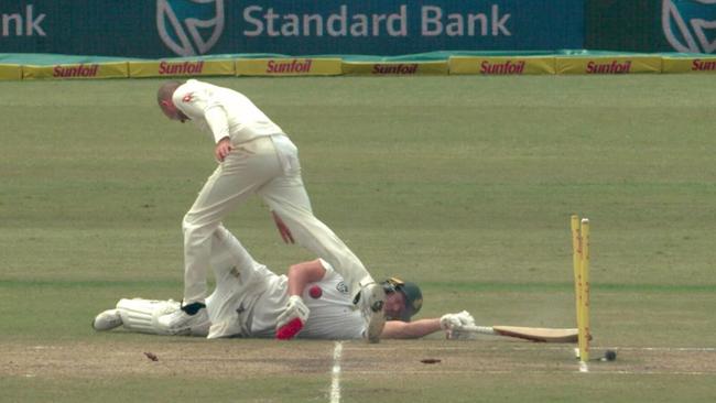 Nathan Lyon wheels away in celebration after running AB de Villiers out.
