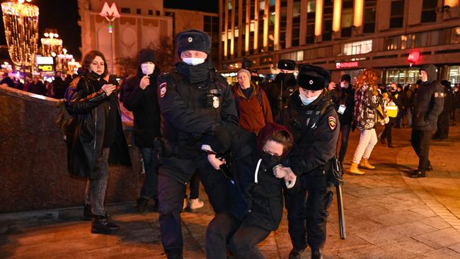 Police officers detain a woman during a protest against Russia's invasion of Ukraine in Moscow. Picture: AFP