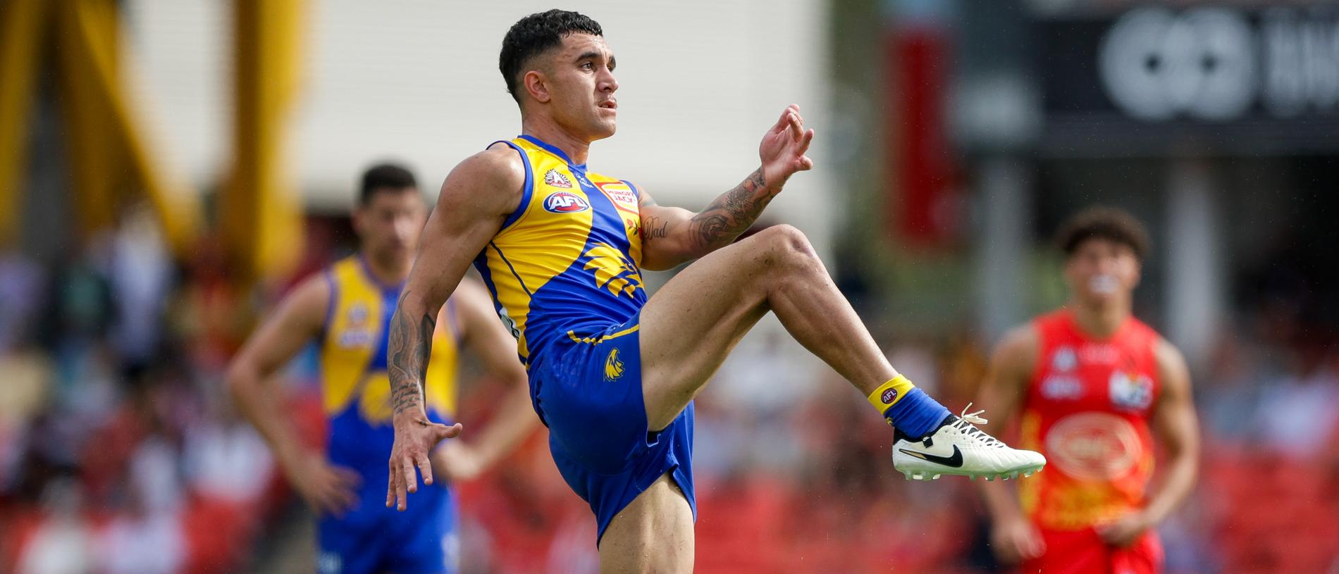 GOLD COAST, AUSTRALIA - APRIL 28: Tyler Brockman of the Eagles kicks the ball during the 2024 AFL Round 07 match between the Gold Coast SUNS and the West Coast Eagles at People First Stadium on April 28, 2024 in Gold Coast, Australia. (Photo by Russell Freeman/AFL Photos via Getty Images)