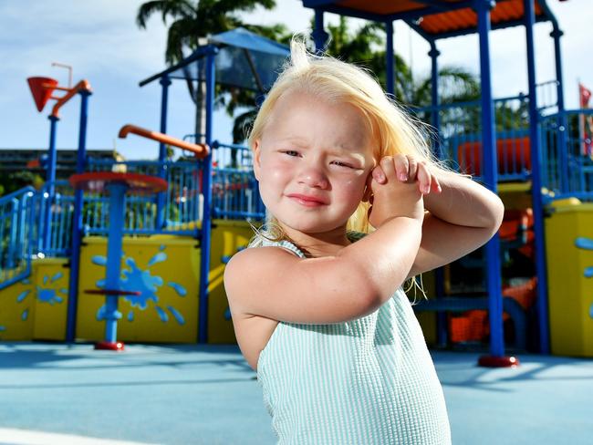 Harper Evans 3, visiting from Cairns with her family, is unhappy to miss out on the Strand Waterpark due to water restrictions. Picture: Alix Sweeney