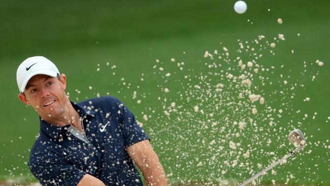 Rory McIlroy plays out of a bunker at the second at Augusta National